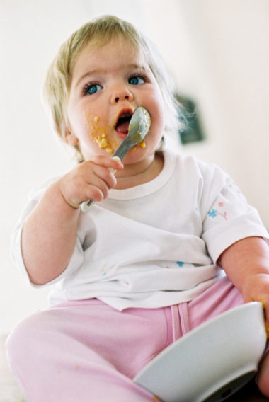 Child eating with spoon