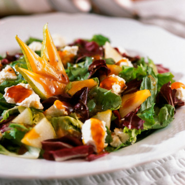 Plate of salad and vegetables, close-up, part of