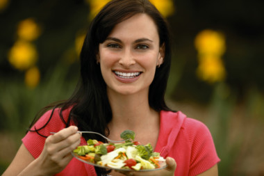 Woman eating salad